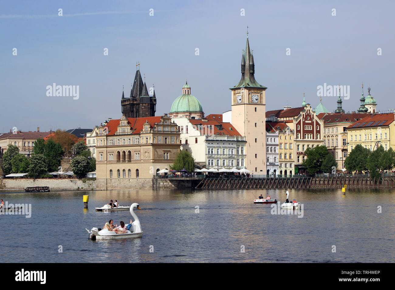Paddle boats on Vltava River, Old Town on background, in Prague, Czech Republic Stock Photo