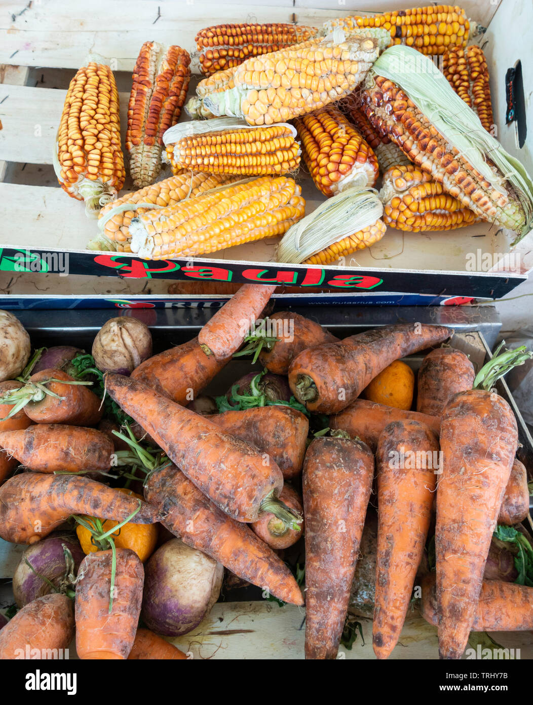 Reduced price loose Carrots and veg on market stall in Spain. Stock Photo