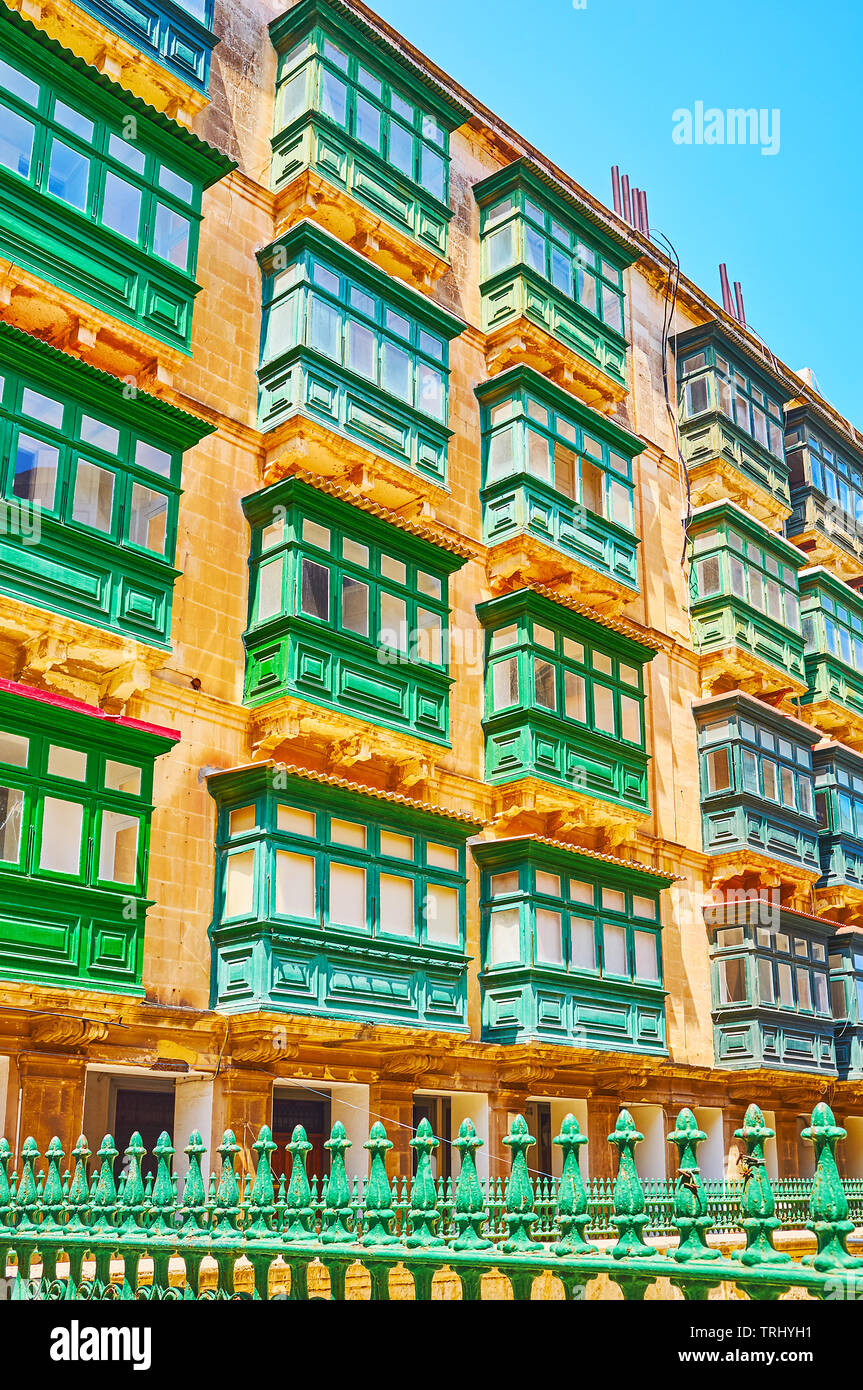The living house in old town with bright green balconies, typical for Maltese architecture, Valletta, Malta. Stock Photo
