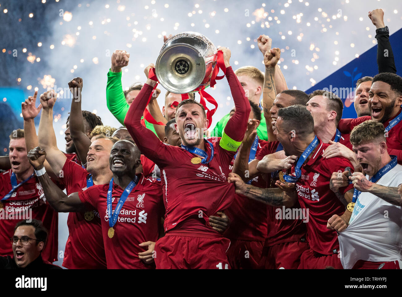 Jordan Henderson of Liverpool lifts the winners trophy with teammates celebrating during the UEFA Champions League FINAL match between Tottenham Hotsp Stock Photo