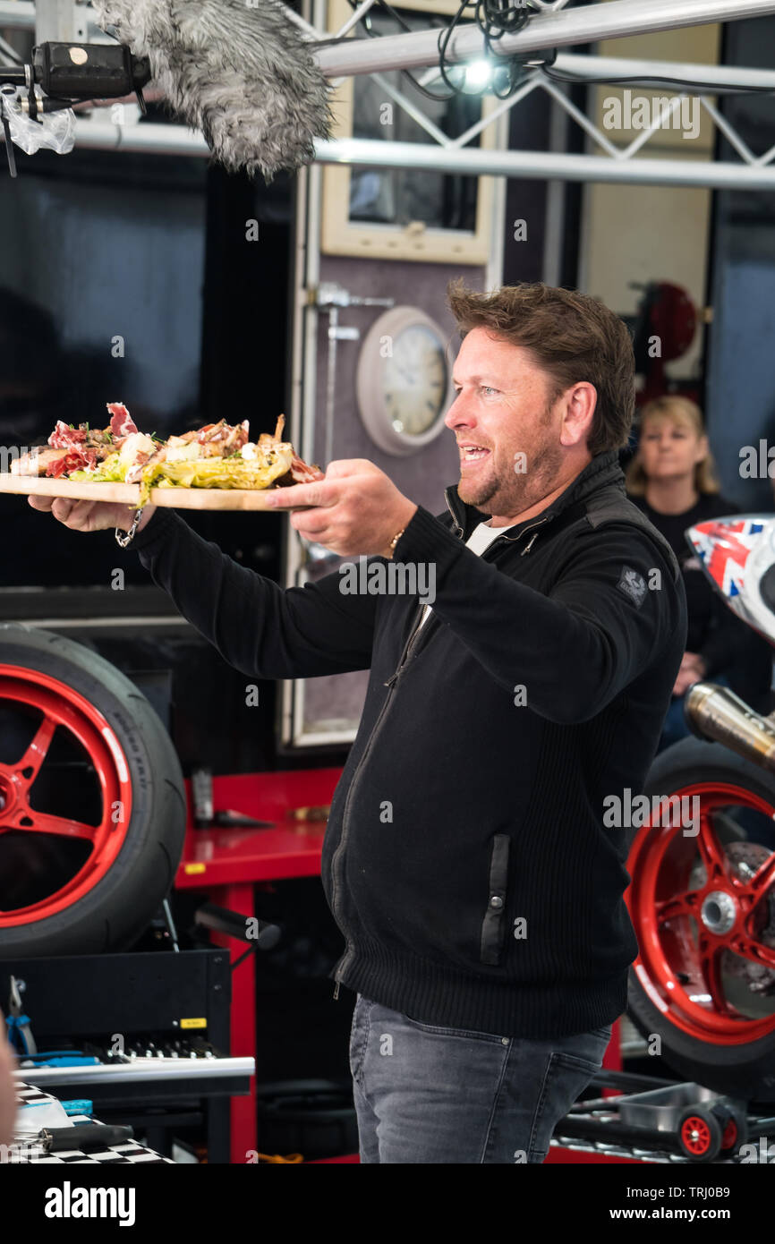 Celebrity chef James Martin, cooking pork chops for TT racer John