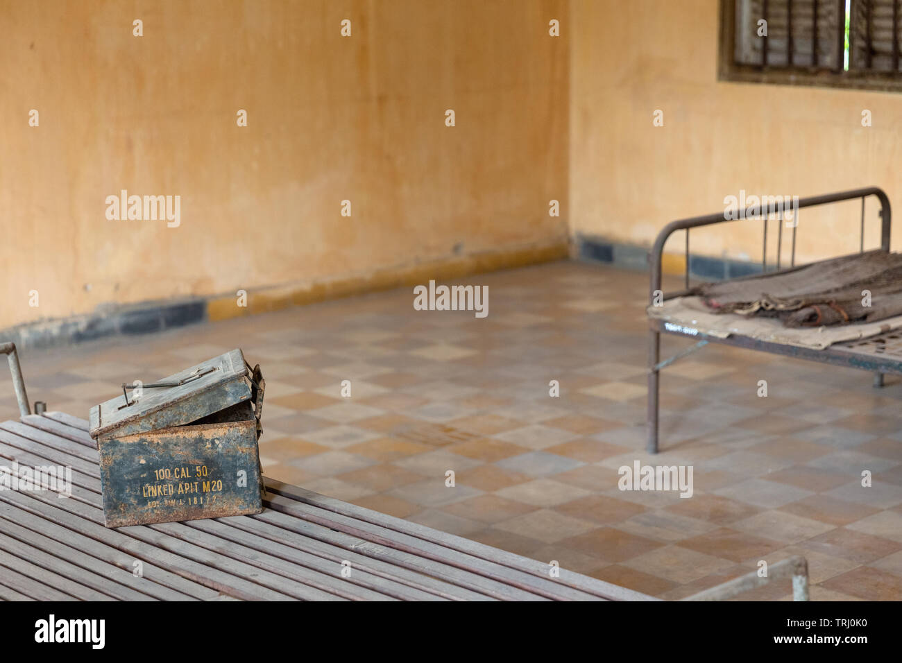 Bed inside interrogation room at Tuol Sleng Genocide Museum, Phnom Penh, Cambodia, Asia Stock Photo