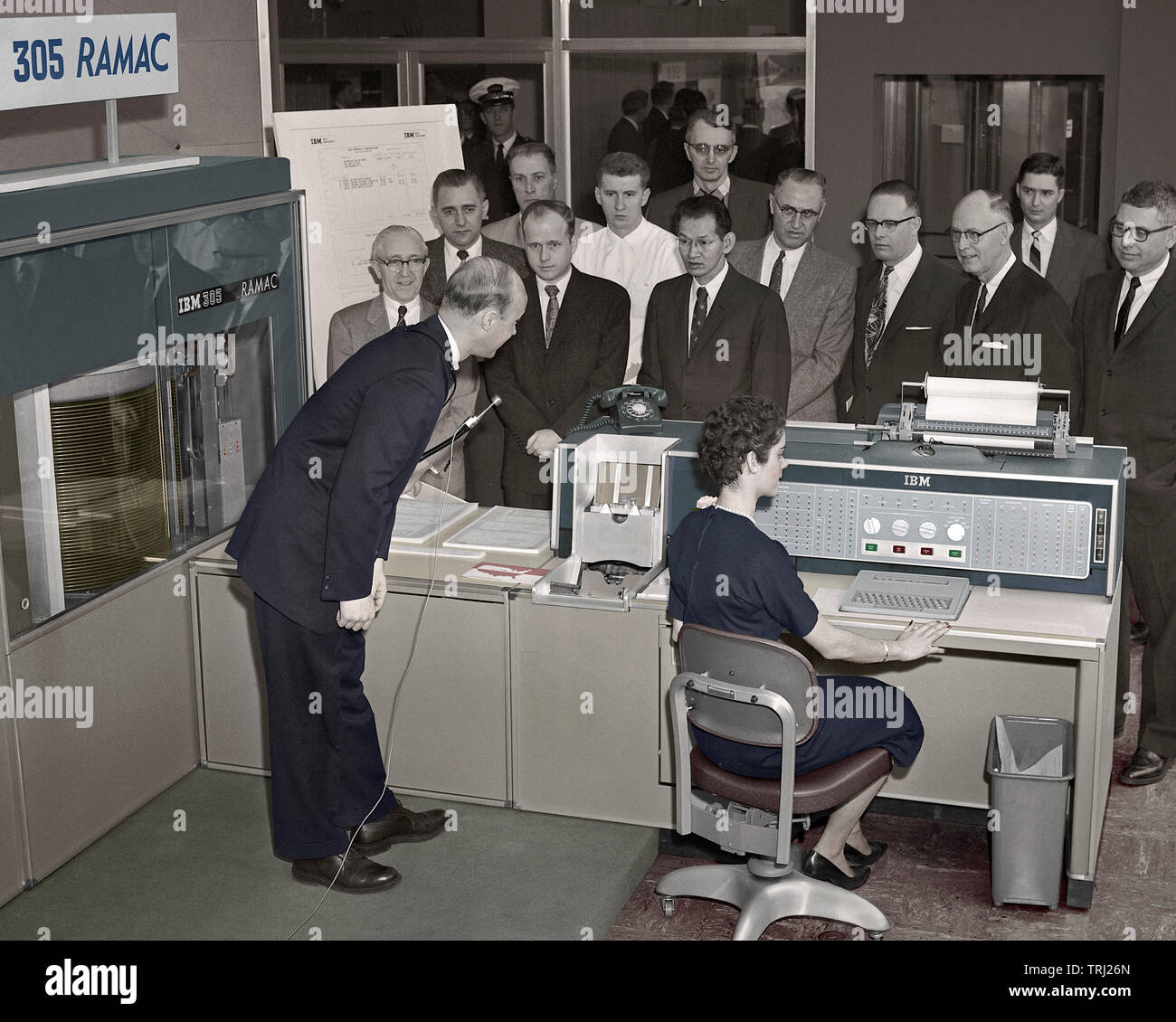 A salesman demonstrating to prospective customers in Chicago the IBM RAMAC computer. March 5, 1958. Stock Photo