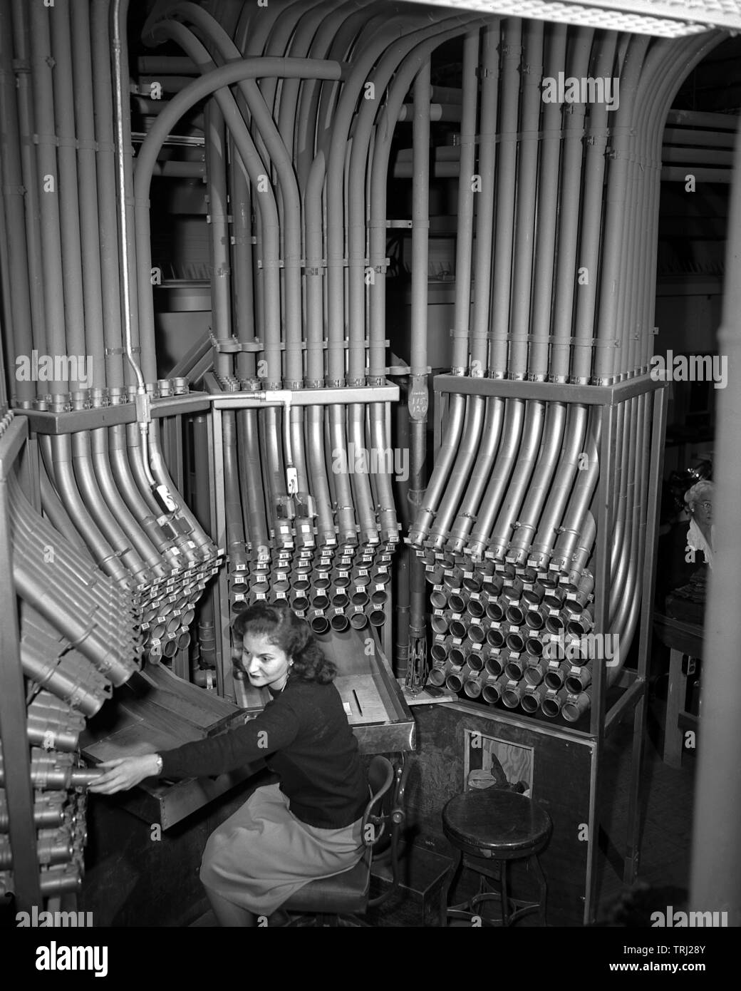 The Pneumatic Tube Room at department store Marshal Fields in Chicago, IL. Tubes whisks transaction in 90 seconds, 1947. Stock Photo