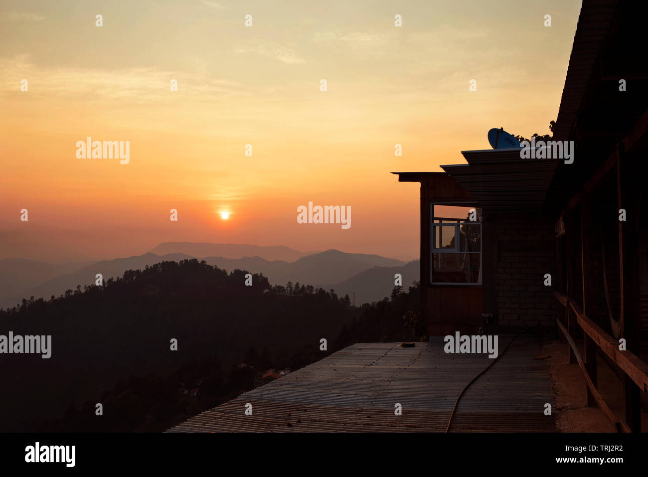 Rooftop Of Wooden Cabins With Mountain Views During Sunset San