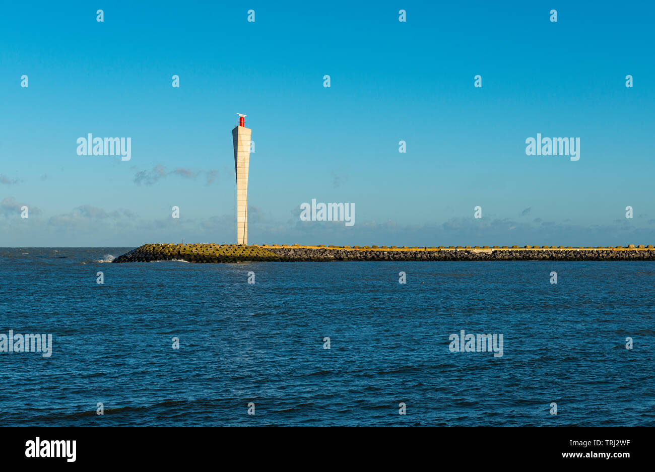 The new radar tower at the end of the waterfront and entrance for the harbor of Ostend city, West Flanders, Belgium. Stock Photo