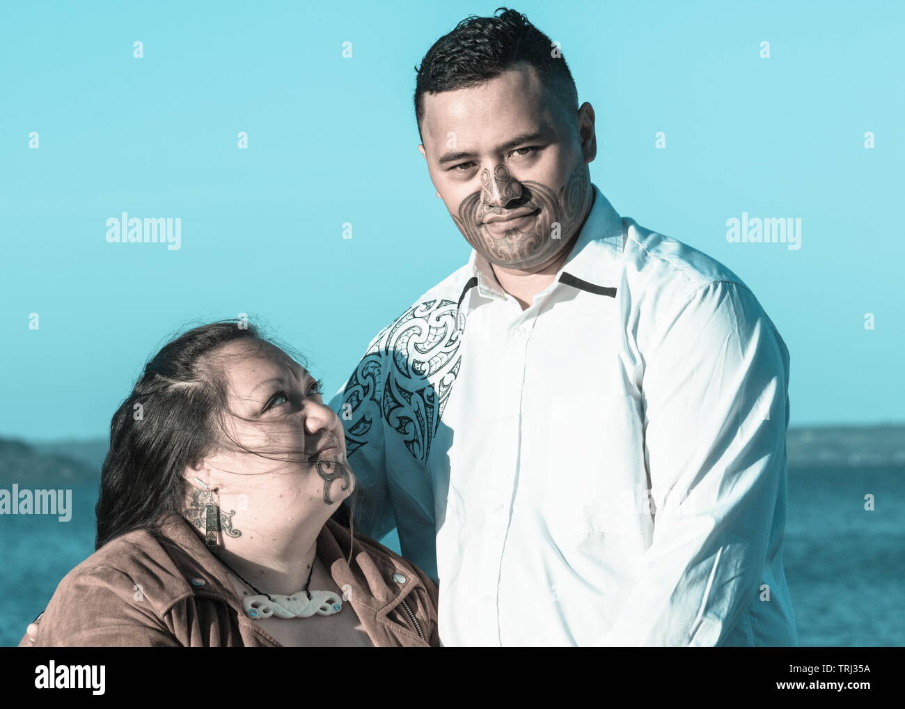 Portrait of an attractive Maori couple taken outdoors Stock Photo