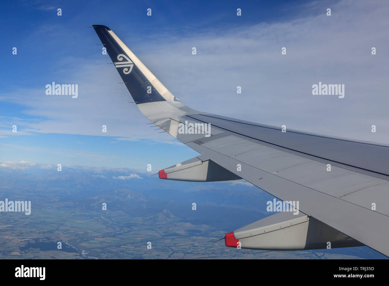 Winglet at the tip of the wing with flaps in normal flight mode Stock Photo