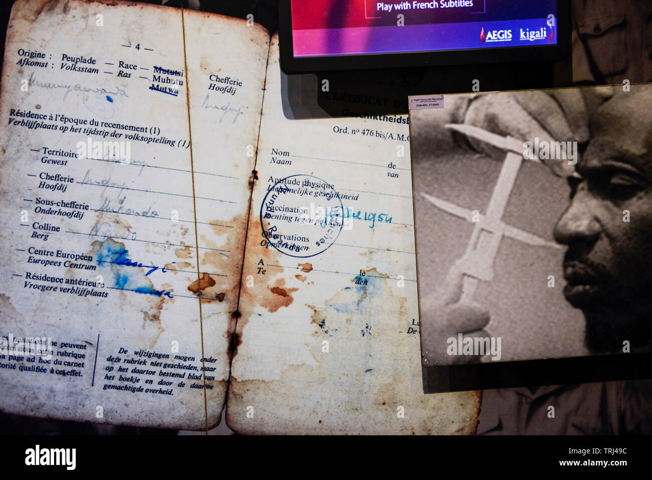 RWANDA, Kigali, Kigali Genocide Memorial , a museum and memorial to remember the genocide of 1994 where about 1 million Tutsi were murdered by Hutu, image of passport from Belgian colonial time with a marking of the race Mu Hutu Mu Tutsi and Mu Twa Stock Photo