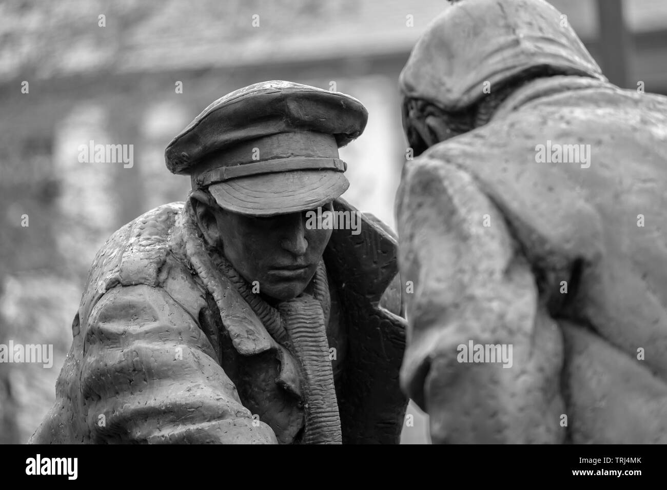 Christmas Truce statue 'All Together Now' by Andrew Edwards, commemorating the WWI Christmas truce and football match, at St Luke's Church, Liverpool Stock Photo