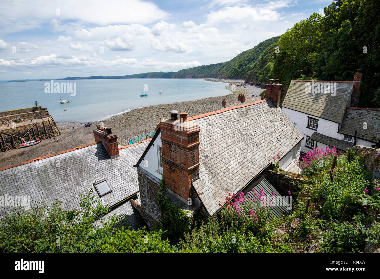 Looking down over rooftops and Bideford Bay in Clovelly, Devon England UK Stock Photo