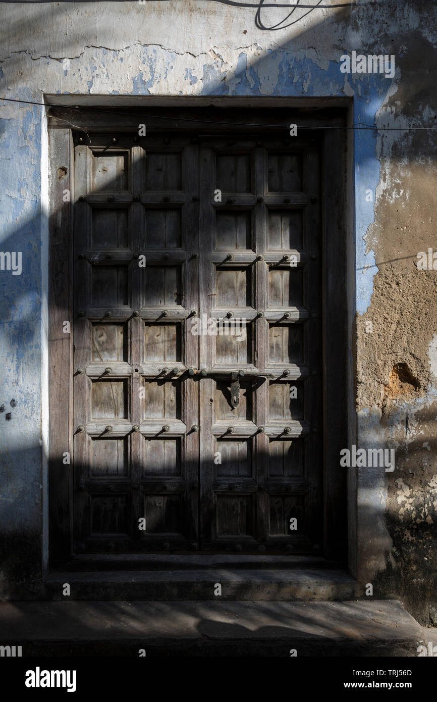 Elaborately carved Zanzibar door manifest the cultural roots of the