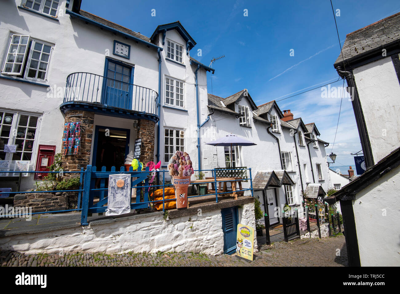 A sunny day on the steep cobbled streets of Clovelly, Devon England UK Stock Photo