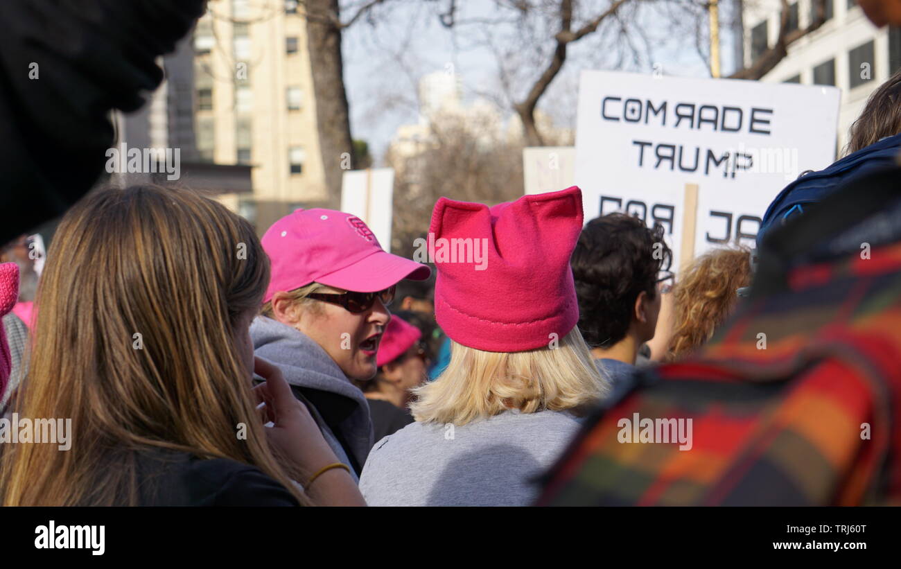 Back of woman wearing pink pussy hat. 2019 Women's March, Anti-Trump Protesters, Market Street, San Francisco, California, USA.2019 Women's Stock Photo