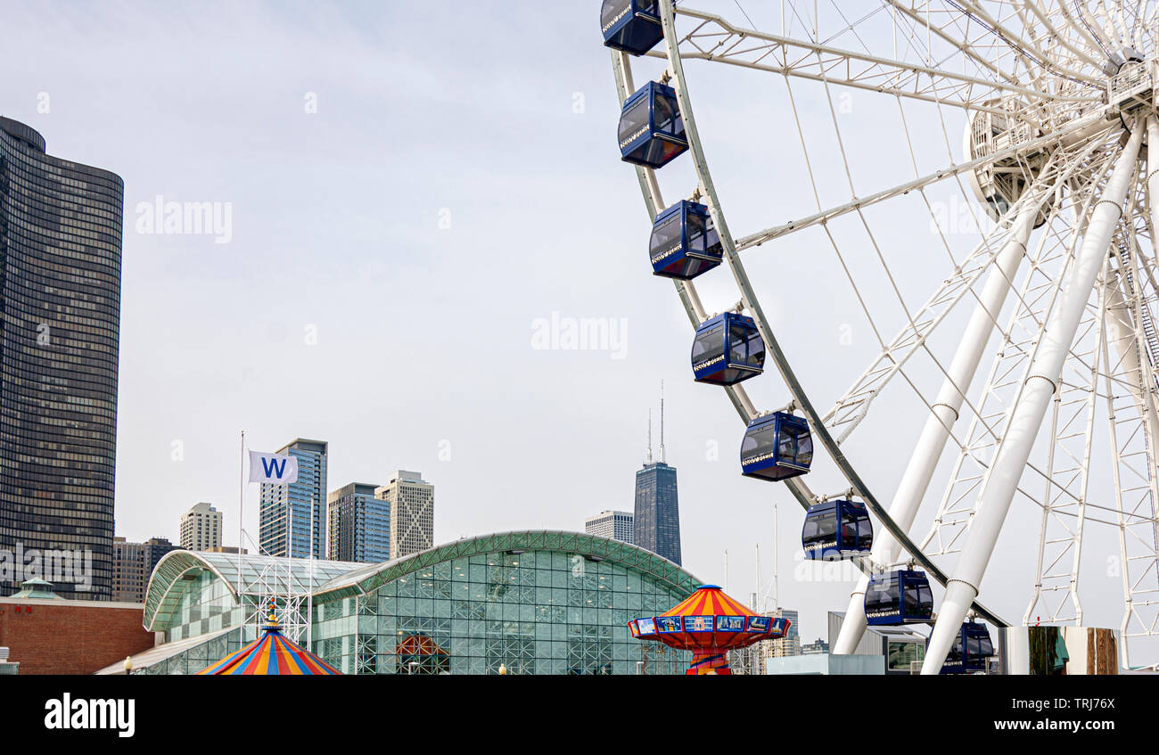 Chicago, IL, USA, October 2016: Chicago's Navy Pier with the Ferris wheel and city skyline with skyscrapers in the background Stock Photo