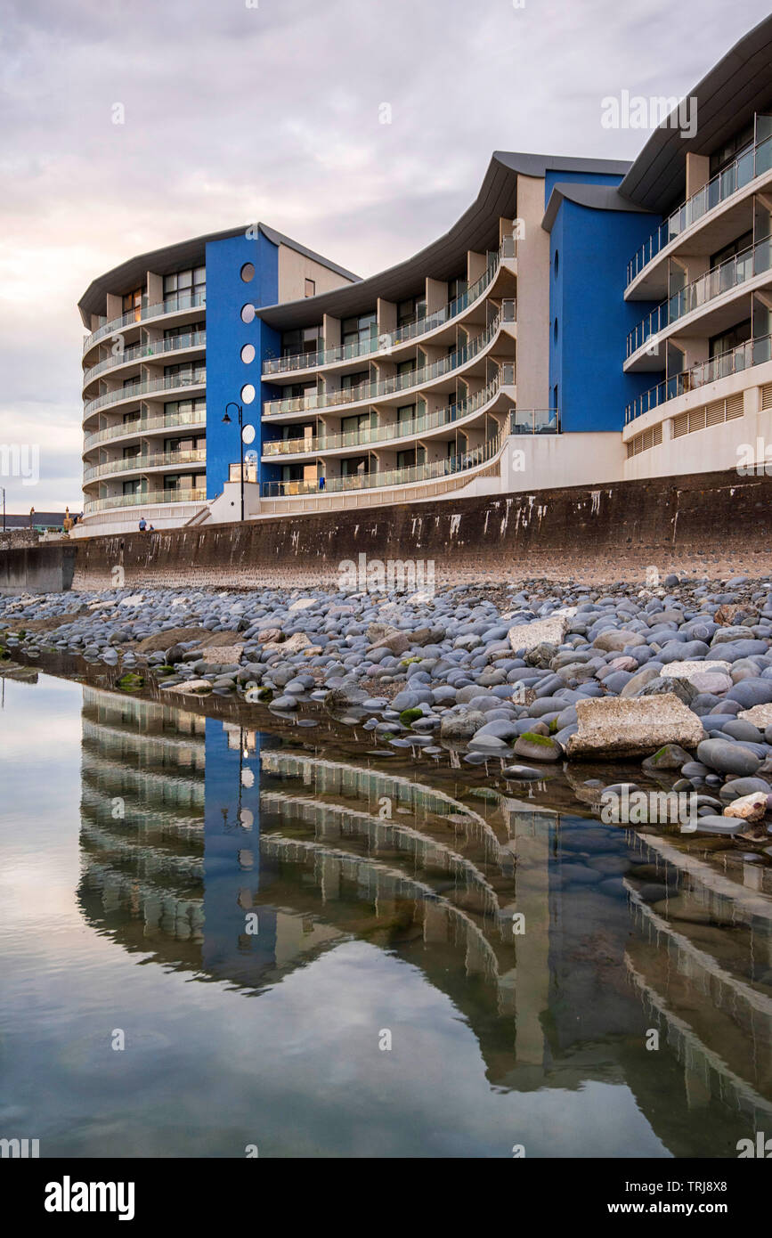 Dusk at the Horizon View Apartments on the seafront at Westward Ho! in Devon England UK Stock Photo