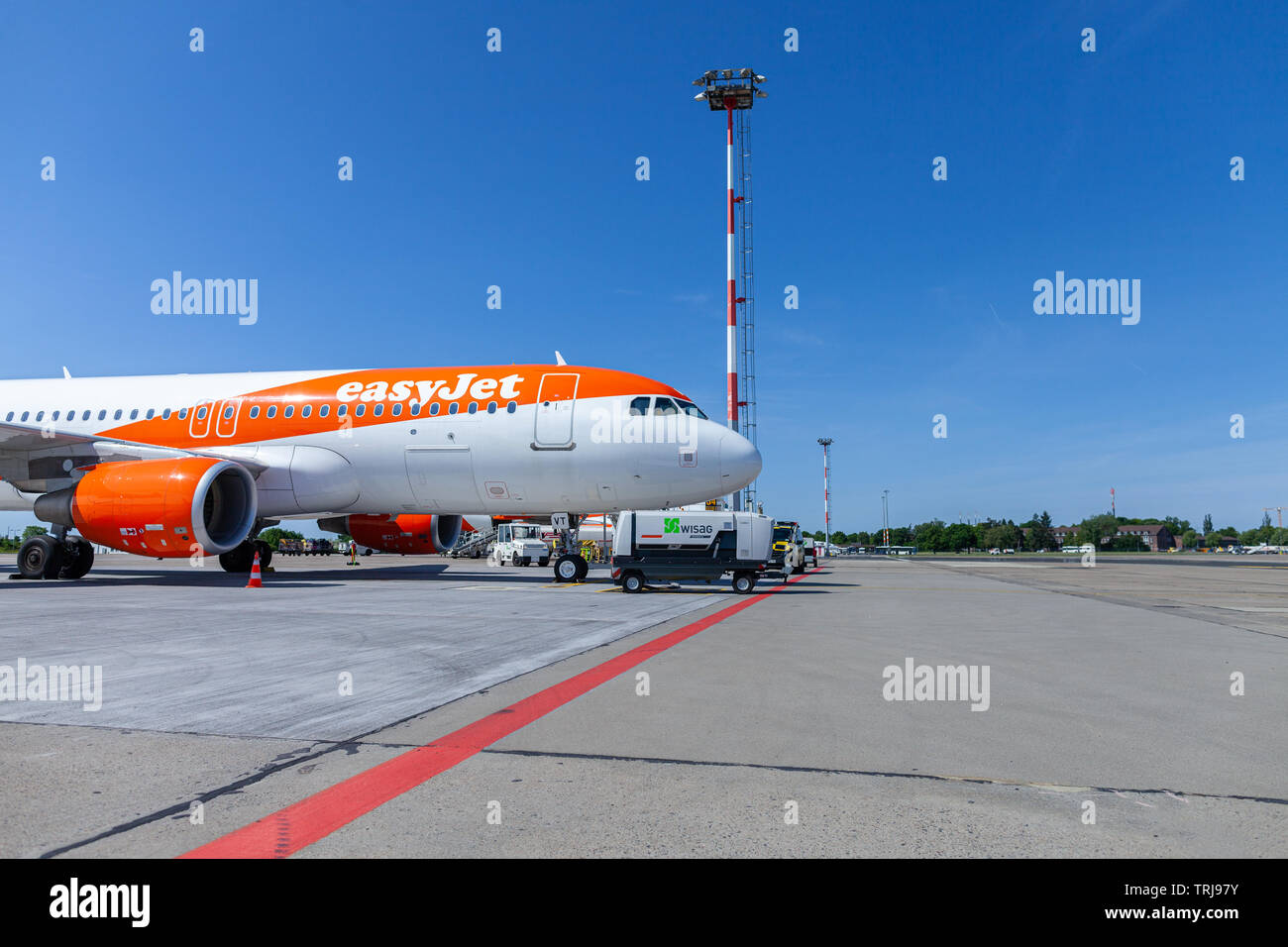BERLIN SCHONEFELD / GERMANY - MAY 30, 2019: Airbus A320-200 from the easyjet airline stands at airfield on Berlin Schonefeld Airport. Stock Photo
