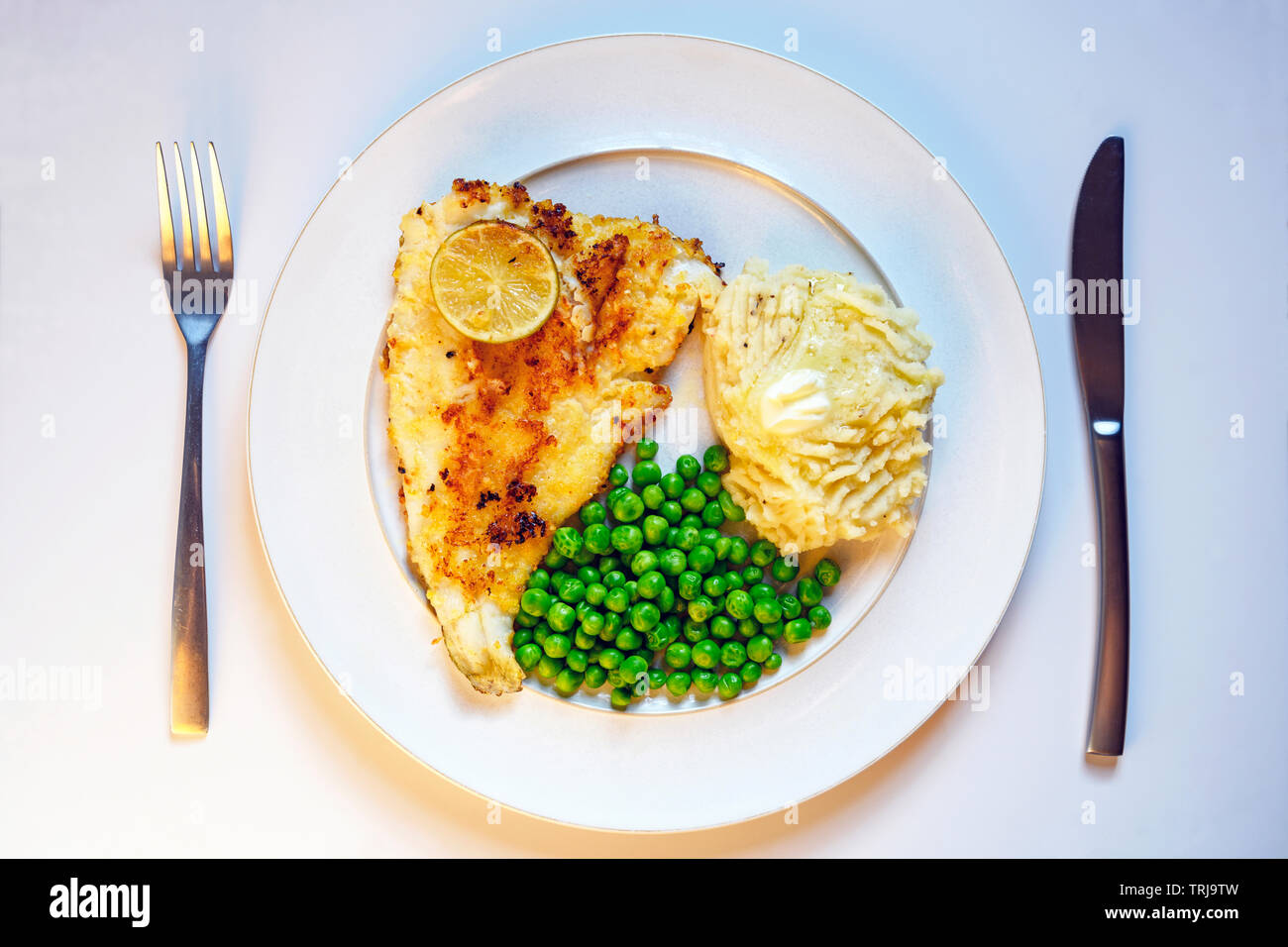 Sea Bass with garden peas and mashed potatoes Stock Photo