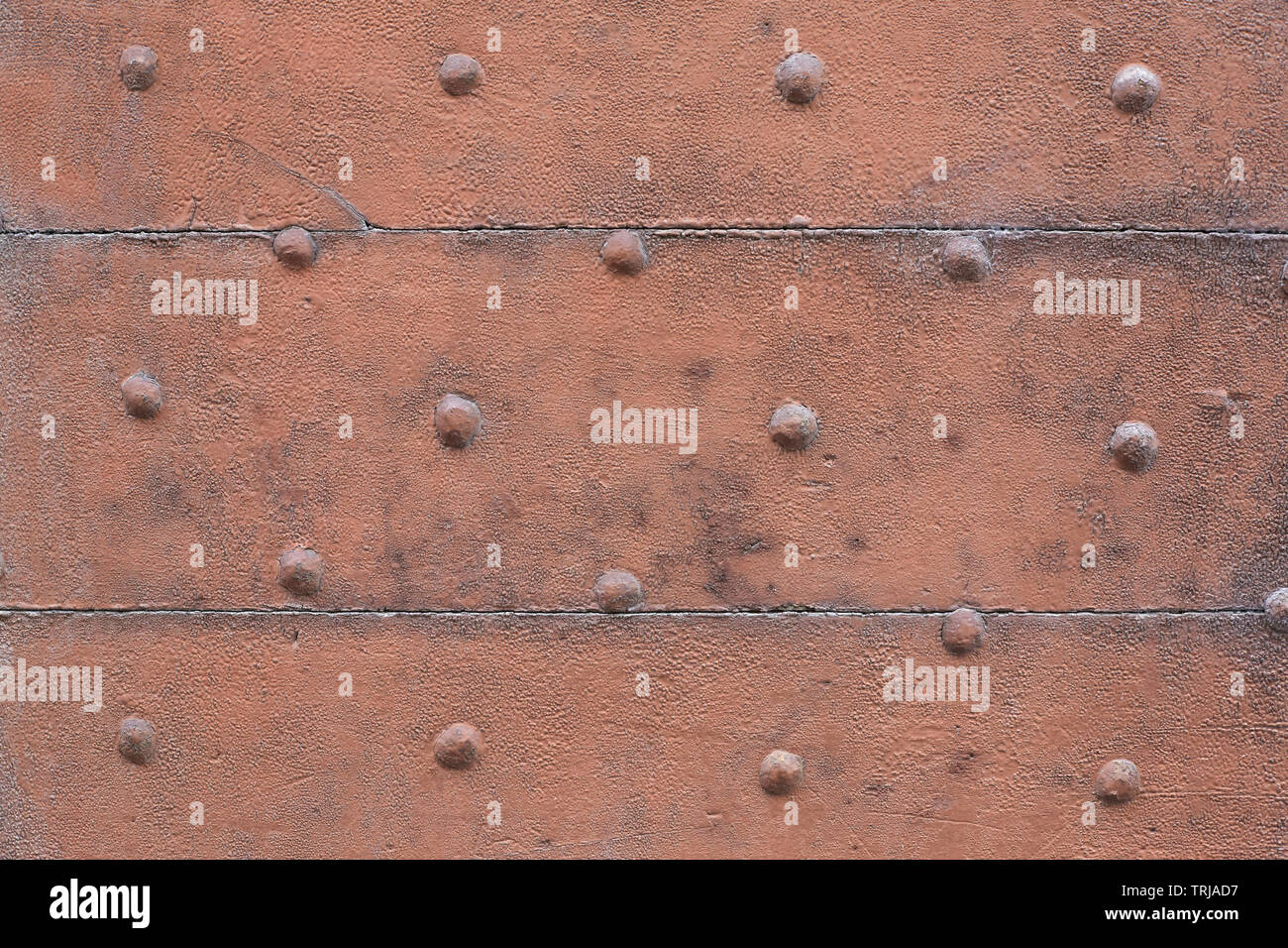 Old wooden, brown painted, door with nails texture background Stock Photo