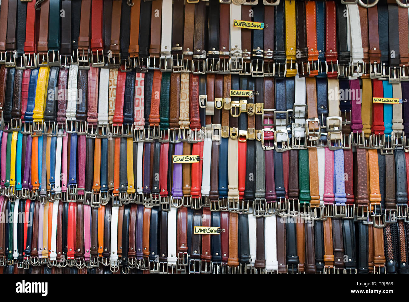 A wide selection of different belts on a market stall in Italy. Stock Photo
