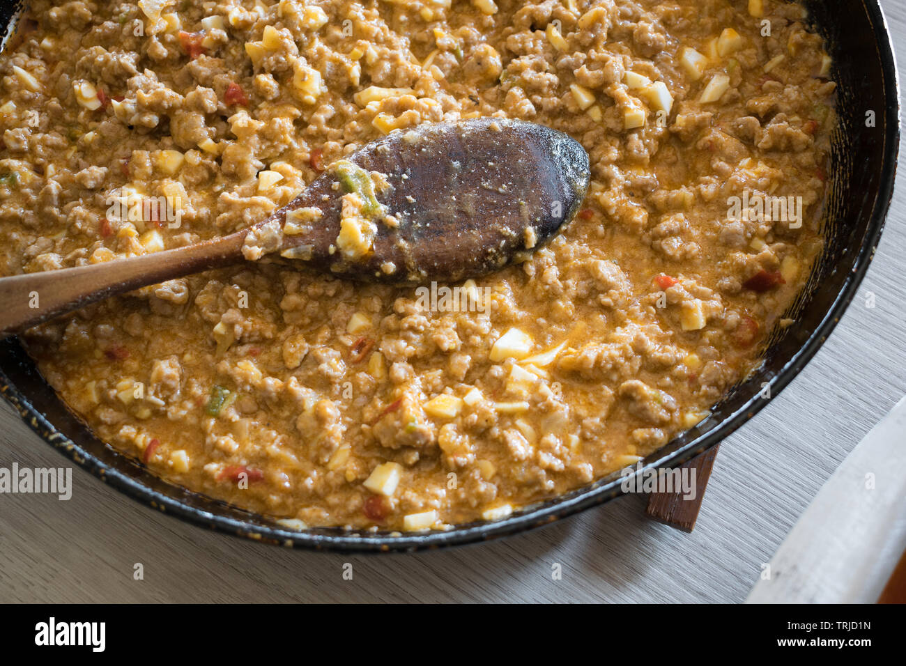 lasagna in an aluminum pan, spatula taking a piece of the pan, selective  focus Stock Photo - Alamy