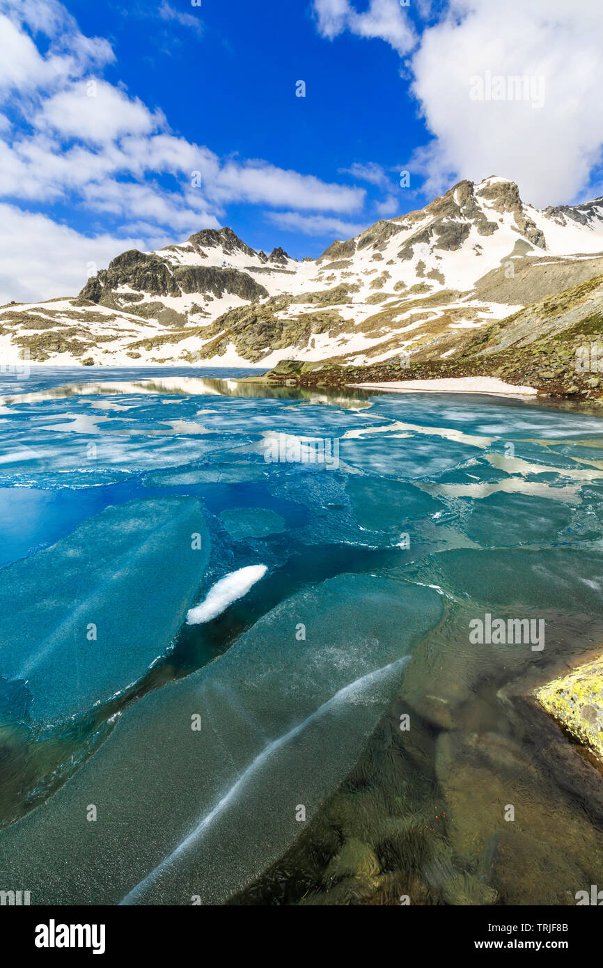 Melting ice at Lej da la Tscheppa during spring thaw, St. Moritz, Engadin, canton of Graubunden, Switzerland Stock Photo