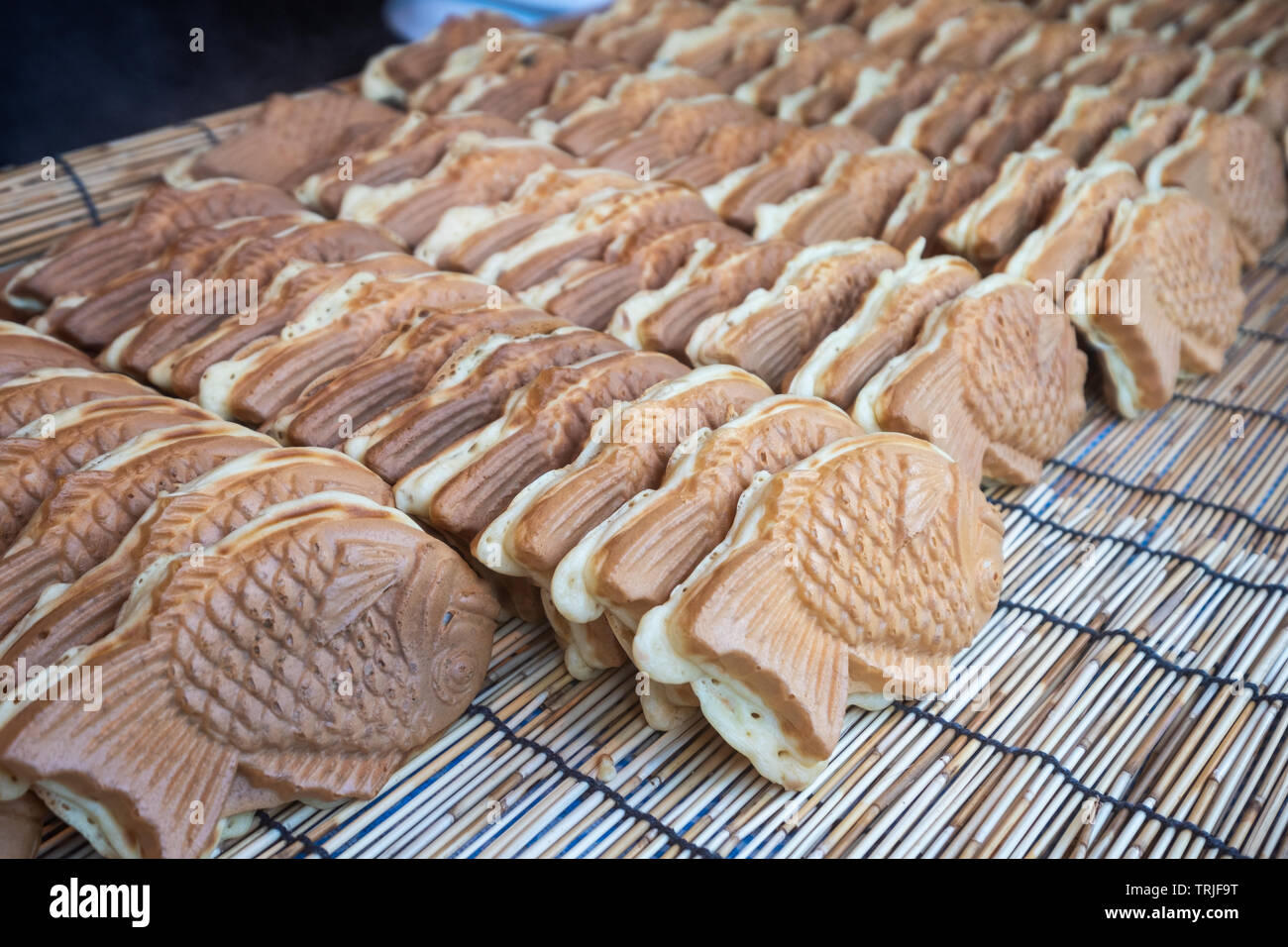 Fresh baked Taiyaki, Japanese fish shaped cake filled with red bean paste  in a basket Stock Photo - Alamy