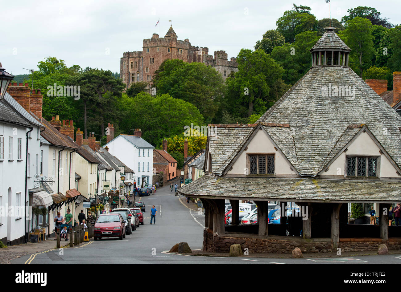 Dunster Exmoor Somerset England UK. May 2019 Showing Dinster Castle and Yarn Market Dunster is a village, civil parish and former manor within the Eng Stock Photo