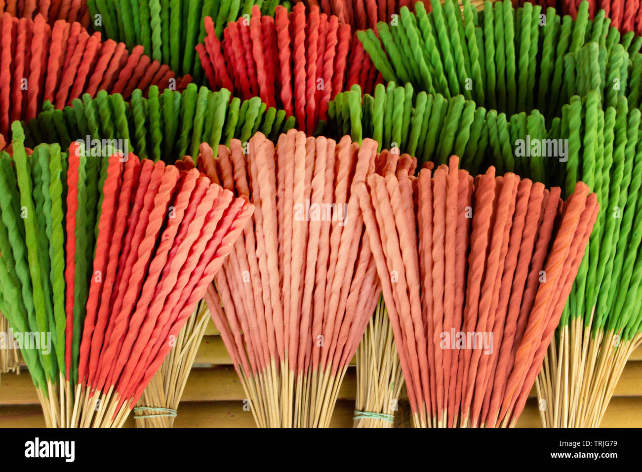 stunning close up of colorfull incense used in thailand as a offer in the temple, amazing combination of different vibrant colors Stock Photo