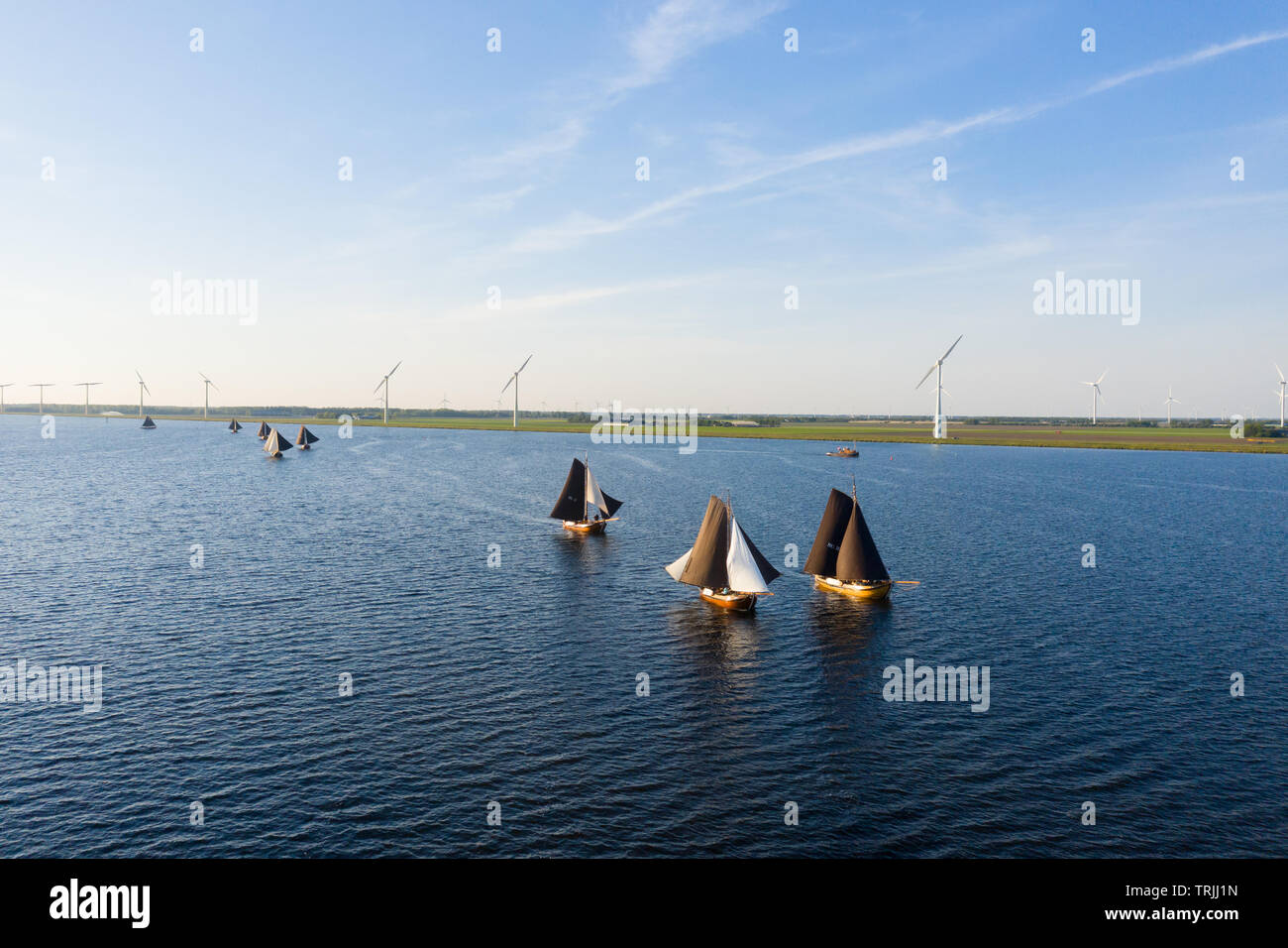 Aerial of typical Dutch blunter ships with on the background fishers village Spakenburg, The Netherlands Stock Photo
