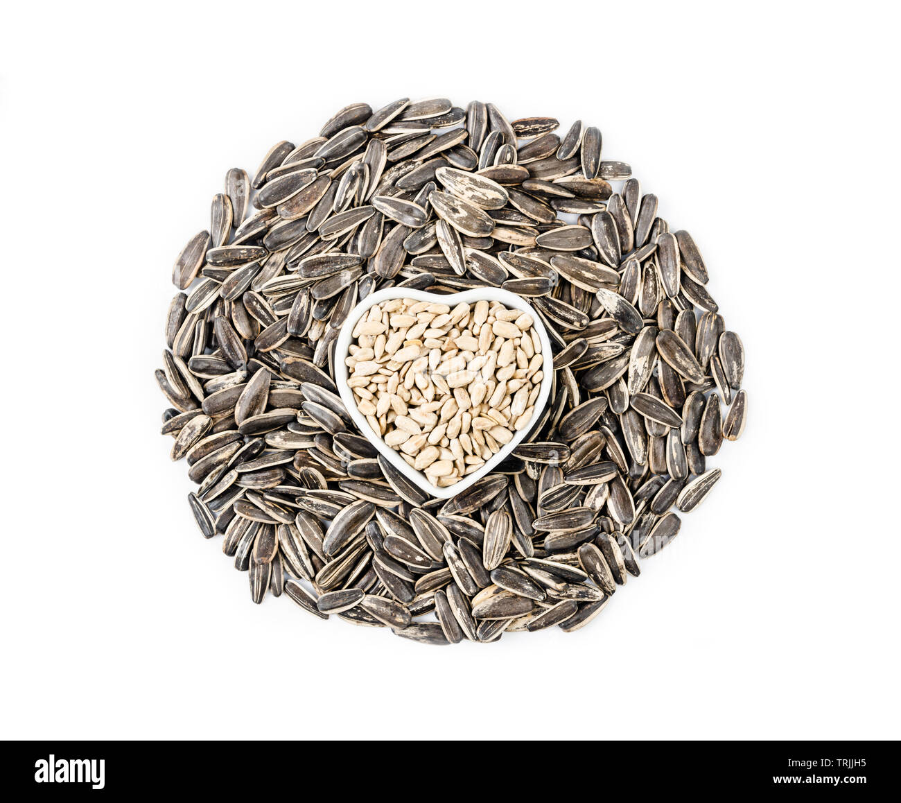 pile of sunflower seeds isolated on white background Stock Photo - Alamy