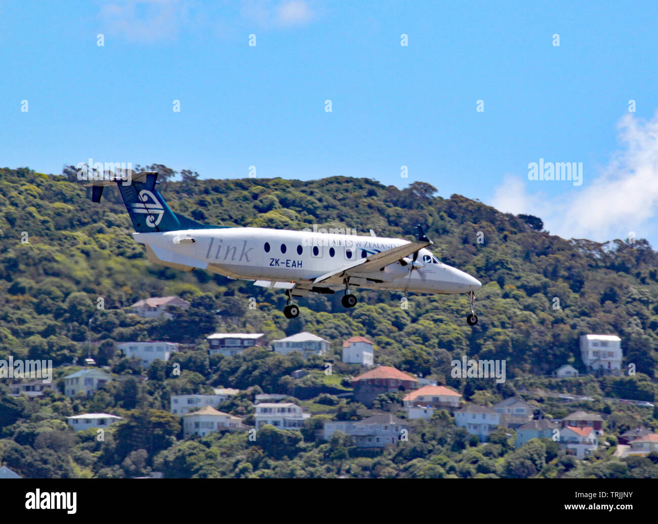 An Air New Zealand Beechcraft 1900D comes in to land at Wellington airport, New Zealand Stock Photo