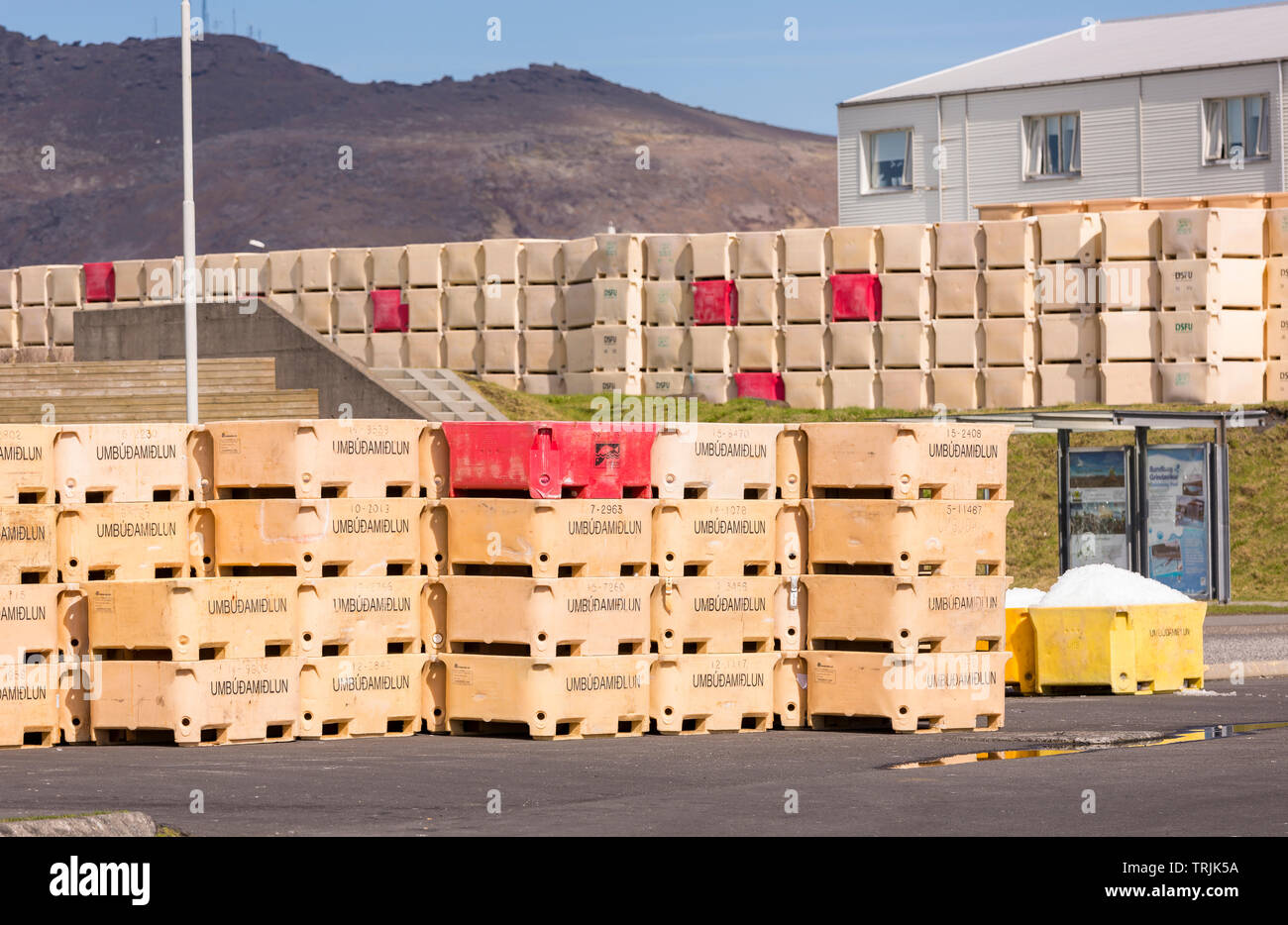 GRINDAVIK, ICELAND - Fishing industry containers in harbor town in southwestern Iceland. Stock Photo