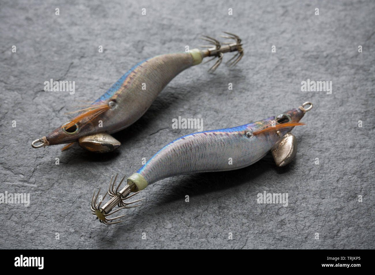 Two Yamashita squid jigs, or lures. Squid fishing has become popular in the UK both for commercial fishermen as well as recreational anglers. The lure Stock Photo