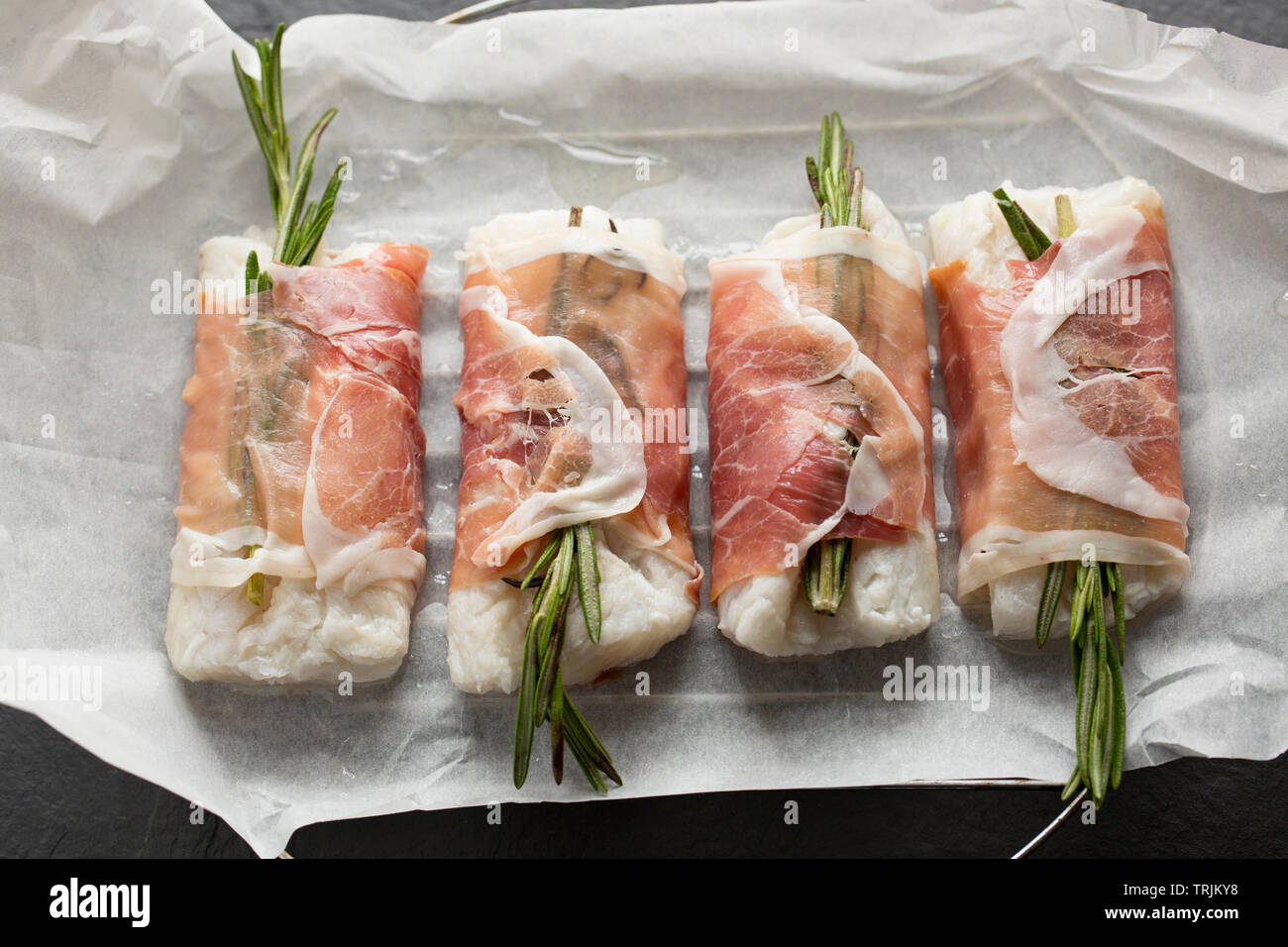 Four raw fillets of pollack, Pollachius pollachius, that have been