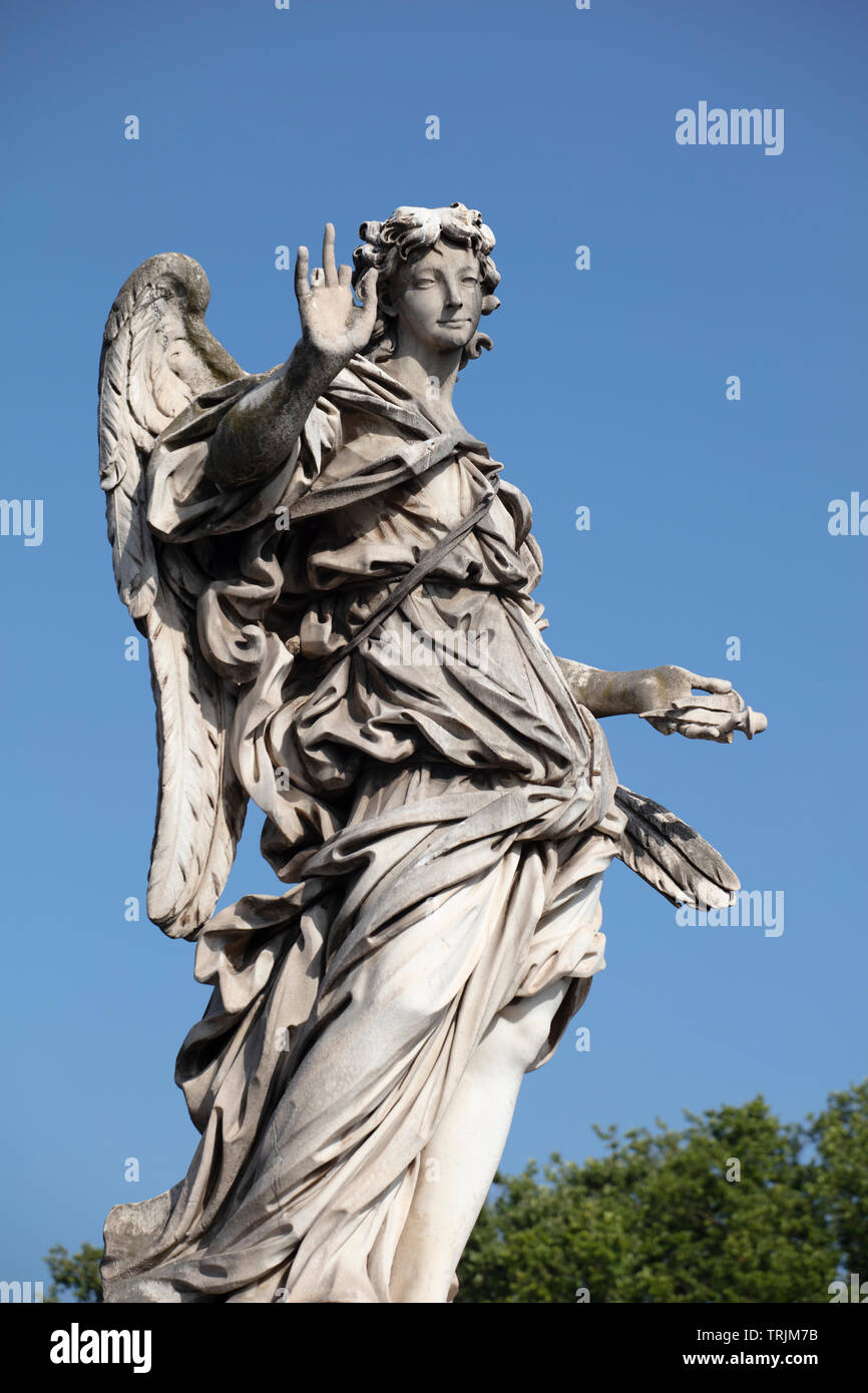 The Marble Statue Of The Angel With The Nails On The Ponte Sant Angelo The Baroque Statue Can Be Seen Against A Deep Blue Summer Sky Stock Photo Alamy