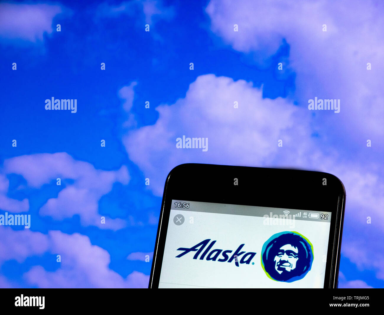 In this photo illustration the Alaska Airlines logo is seen displayed ...