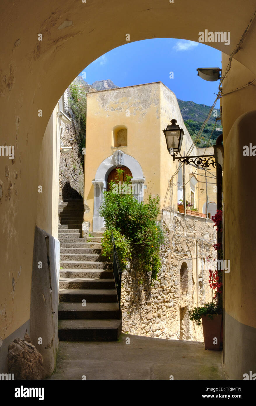 Traditional colourful Italian houses steep steps, arches  and narrow alleys typical of Positano on the Amalfi Coast of Campania in Southern Italy Stock Photo