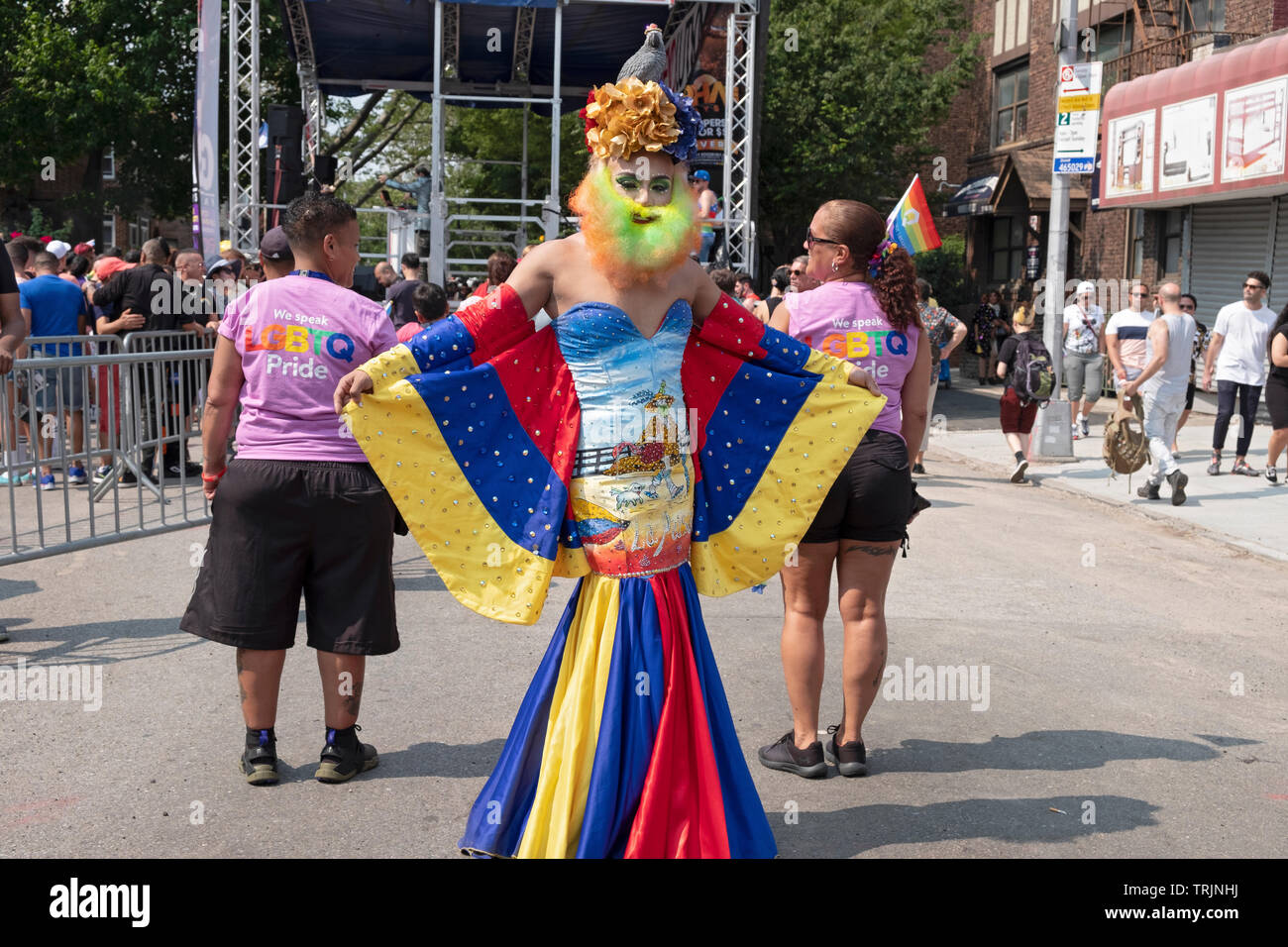 A man in drag with a very colorful costume at the 2019 Queens Pride Parade in Jackson Heights, Queens, New York City. Stock Photo