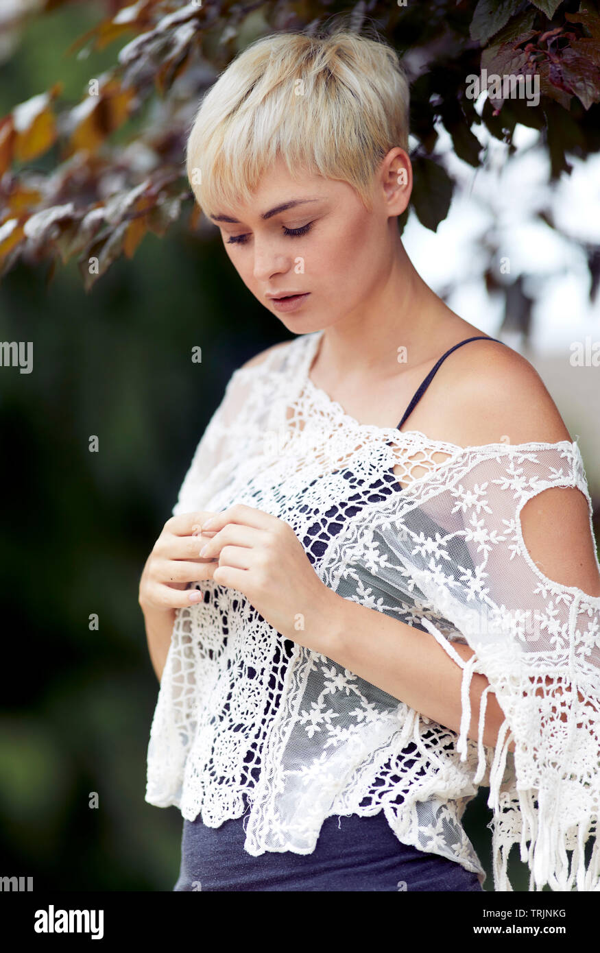 Thoughtful woman outdoors Stock Photo