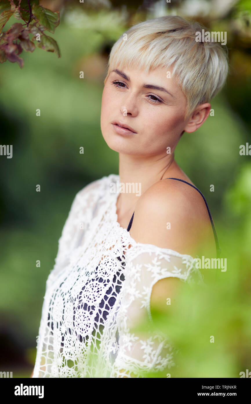 Thoughtful woman outdoors Stock Photo