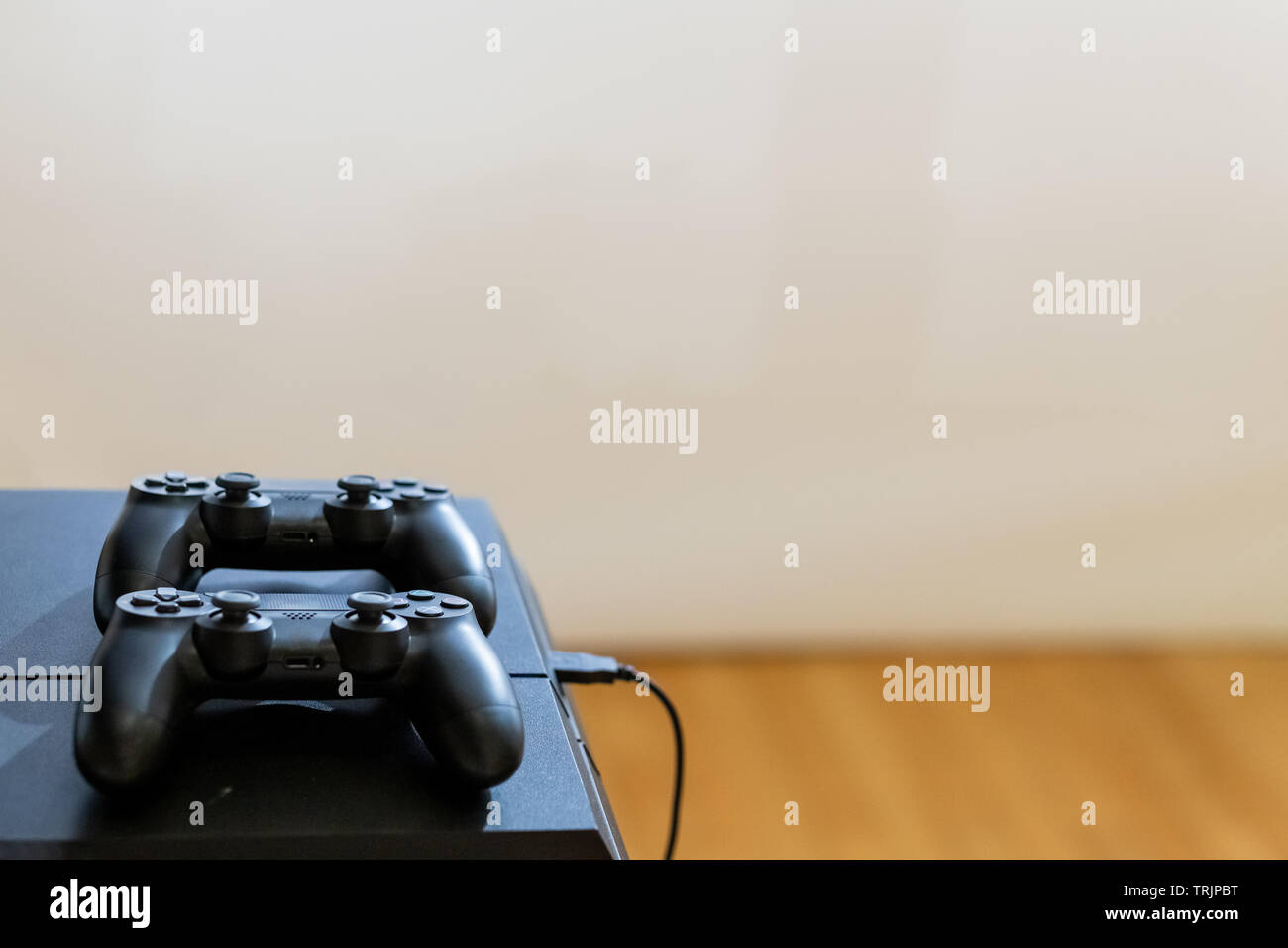 Two joysticks on table. Space for copy. Stock Photo