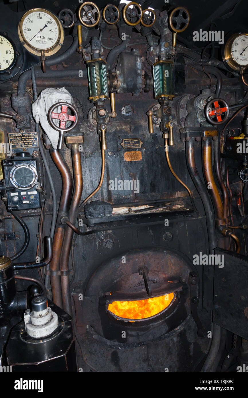 The engineers foot plate and controls for the steam locomotive Union of South Africa 60009 LNER A4 Class during a water stop at Chirk railway station Stock Photo