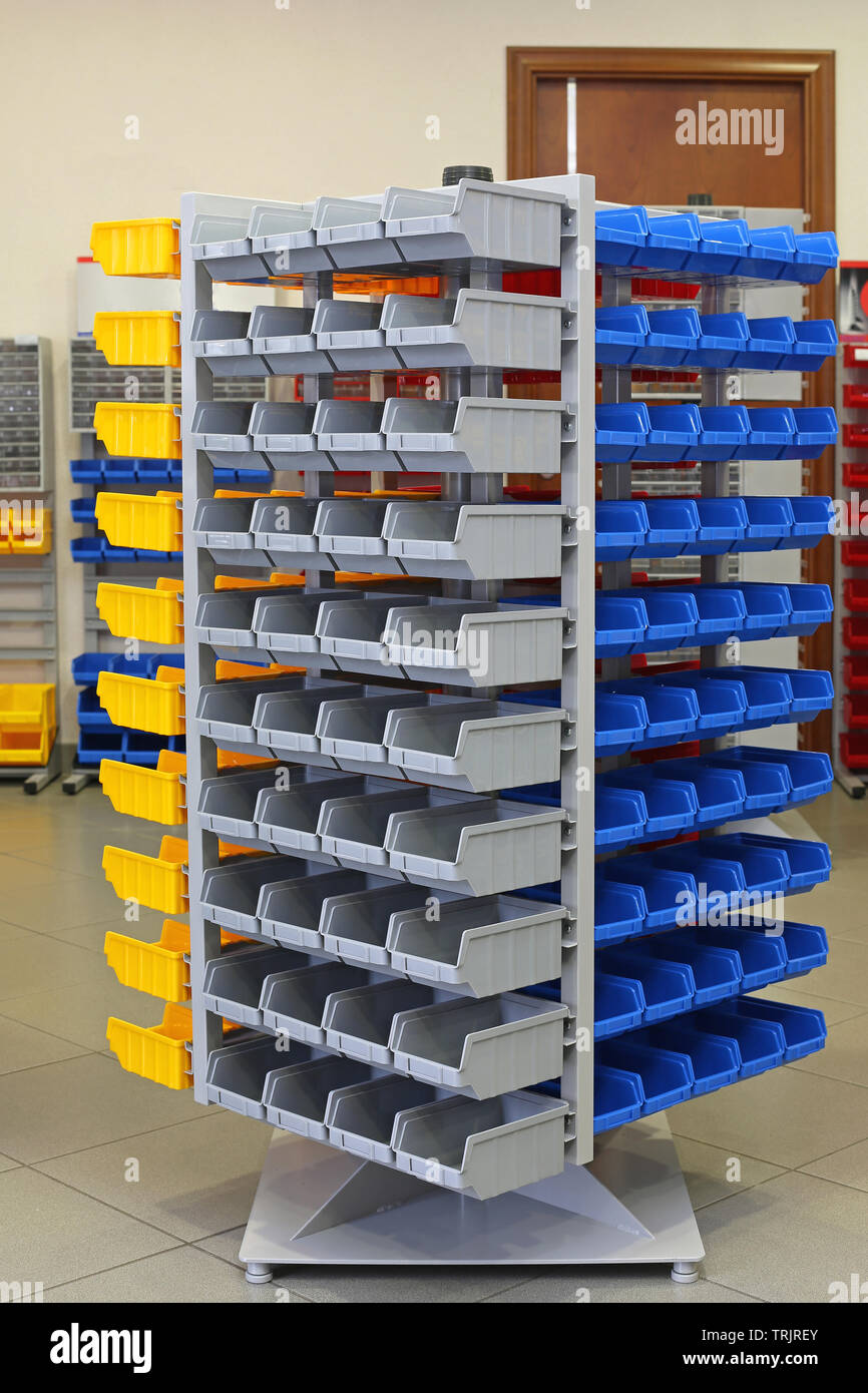 Big Storage Organizer Tower Shelf With Plastic Sorting Bins Stock Photo -  Alamy
