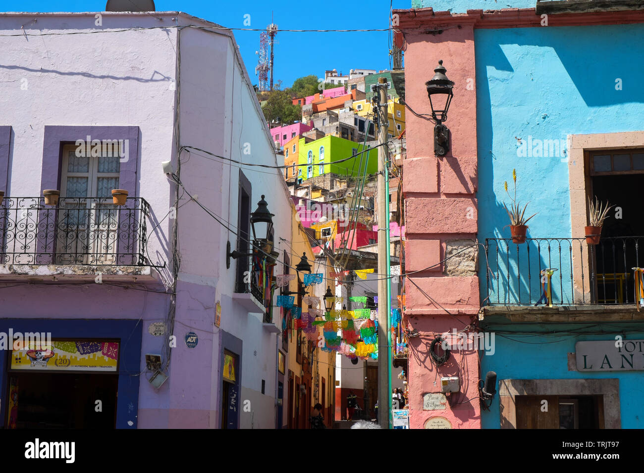 Colorful houses and flags in Guanajuato, Mexico Stock Photo