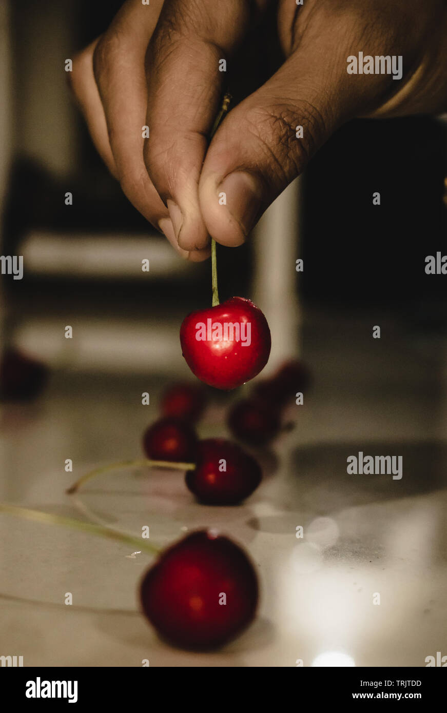 DELICIOUS RED CHERRY ON THE FLOOR, BLOW MY MIND AND WANT TO EAT AS SOON AS POSSIBLE Stock Photo