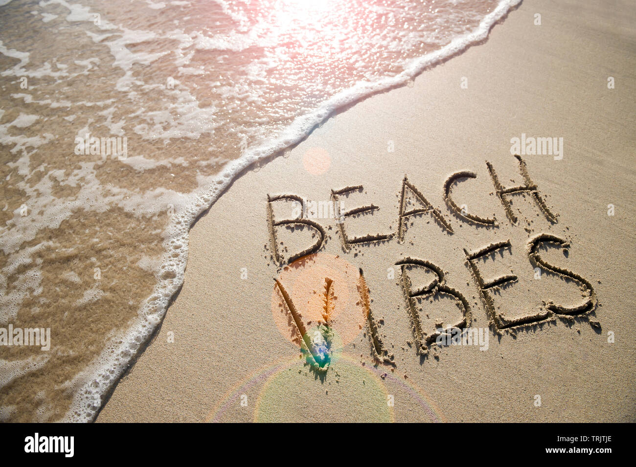 Beach Vibes Tropical Vacation Message Handwritten On Smooth Sand With 