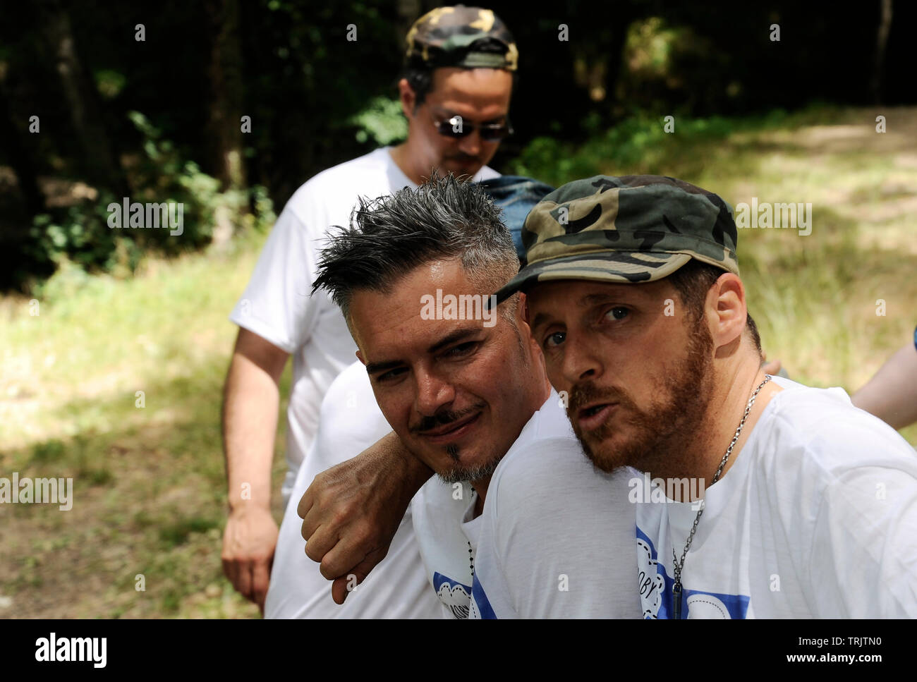 Two friends in the forest have fun taking pictures Stock Photo - Alamy