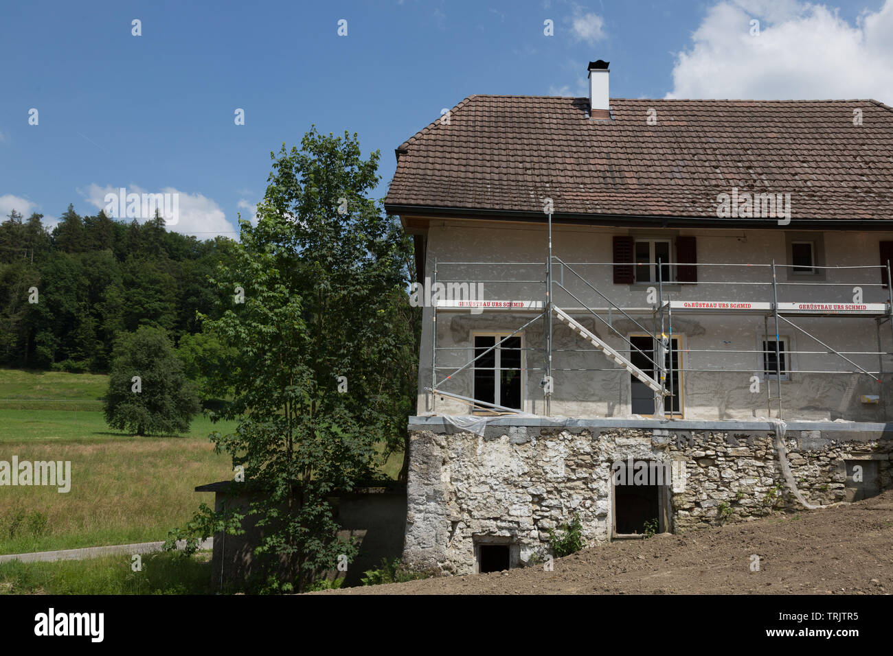 An old 19th century Swiss farm house being remodeled in Aargau, Switzerland. Stock Photo