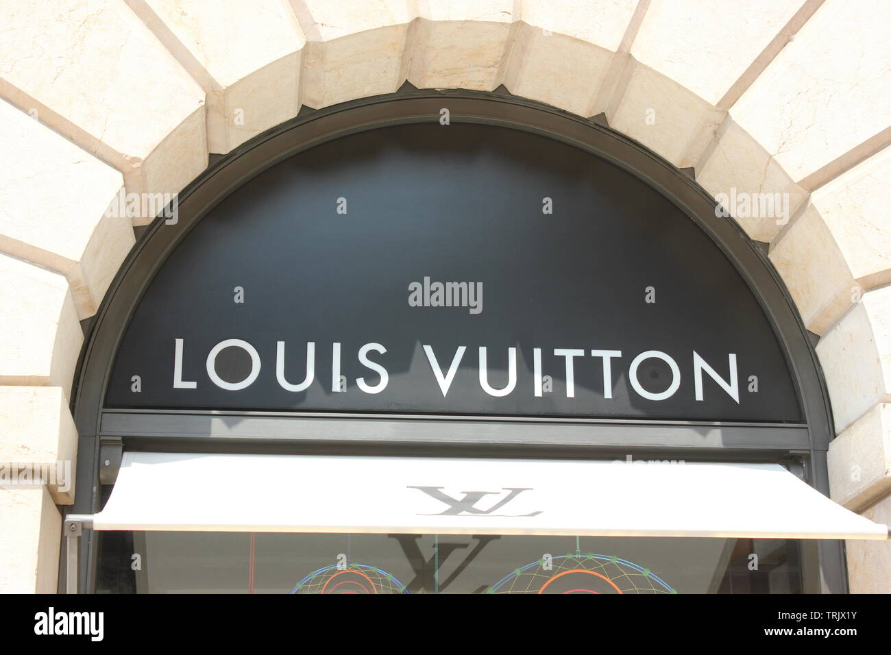 Louis Vuitton logo on store, luxury shopping zone of Verona. Stock Photo